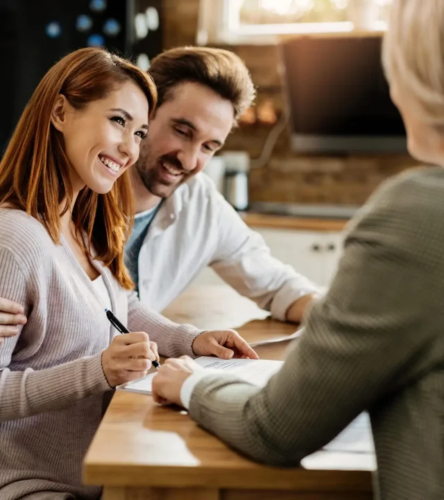 young-happy-woman-her-husband-signing-agreement-with-insurance-agent-meeting-min